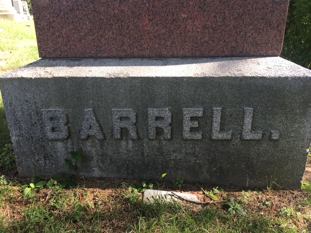 gravestone featuring a period at the end of the family's name