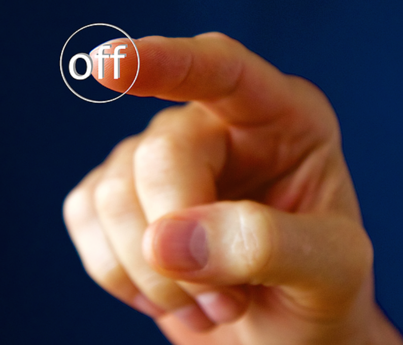 Hitting the off switch — a man's finger pointing to the word OFF